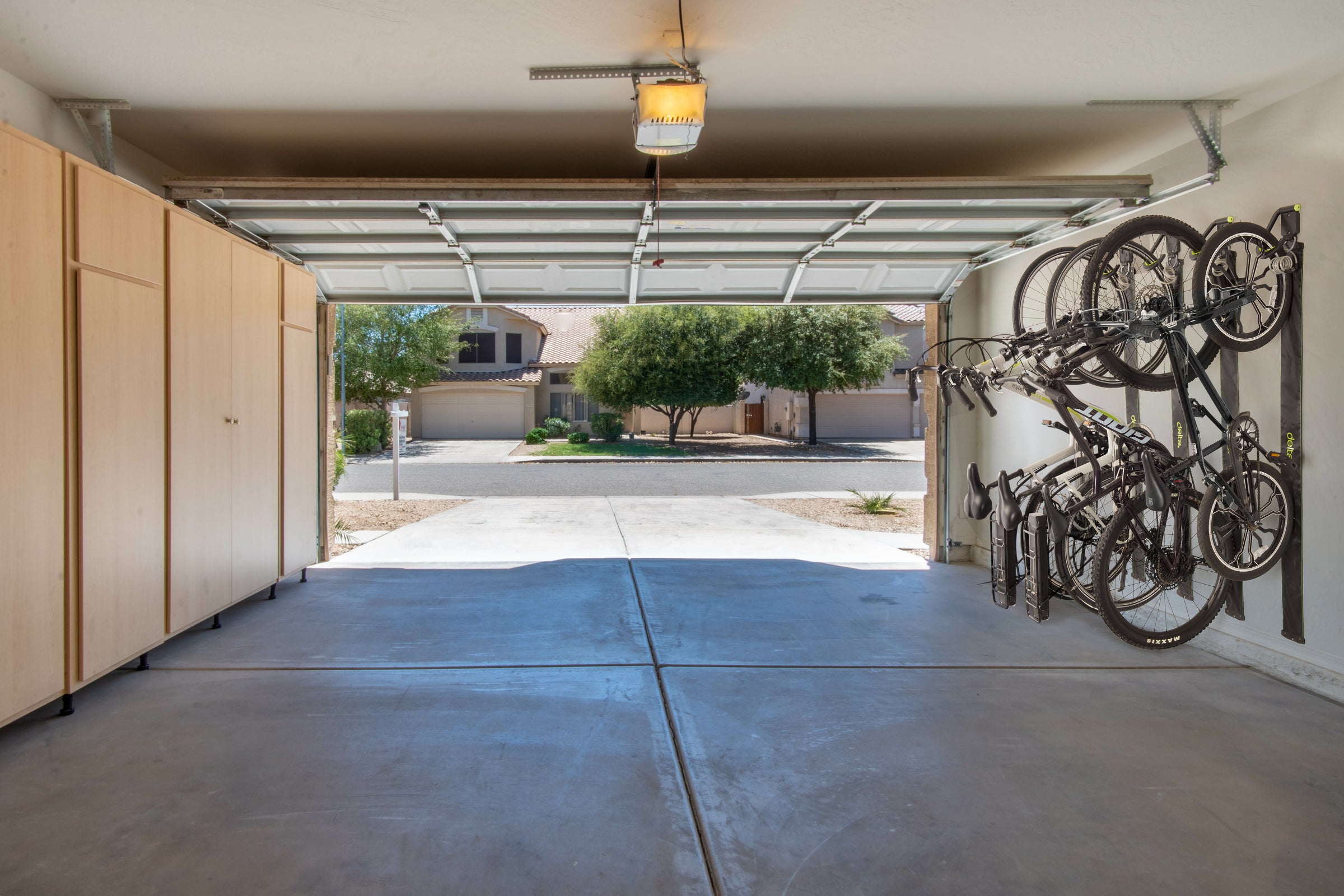 Garage with bicycles hanging on a wall rack