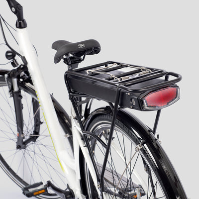 E-Bike rear rack for additional storage and removable battery pack on gray background